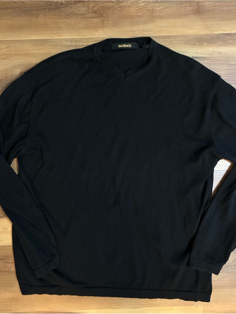 Black long-sleeve V-neck pullover sweater by Bachrach. Size Med 100% cotton